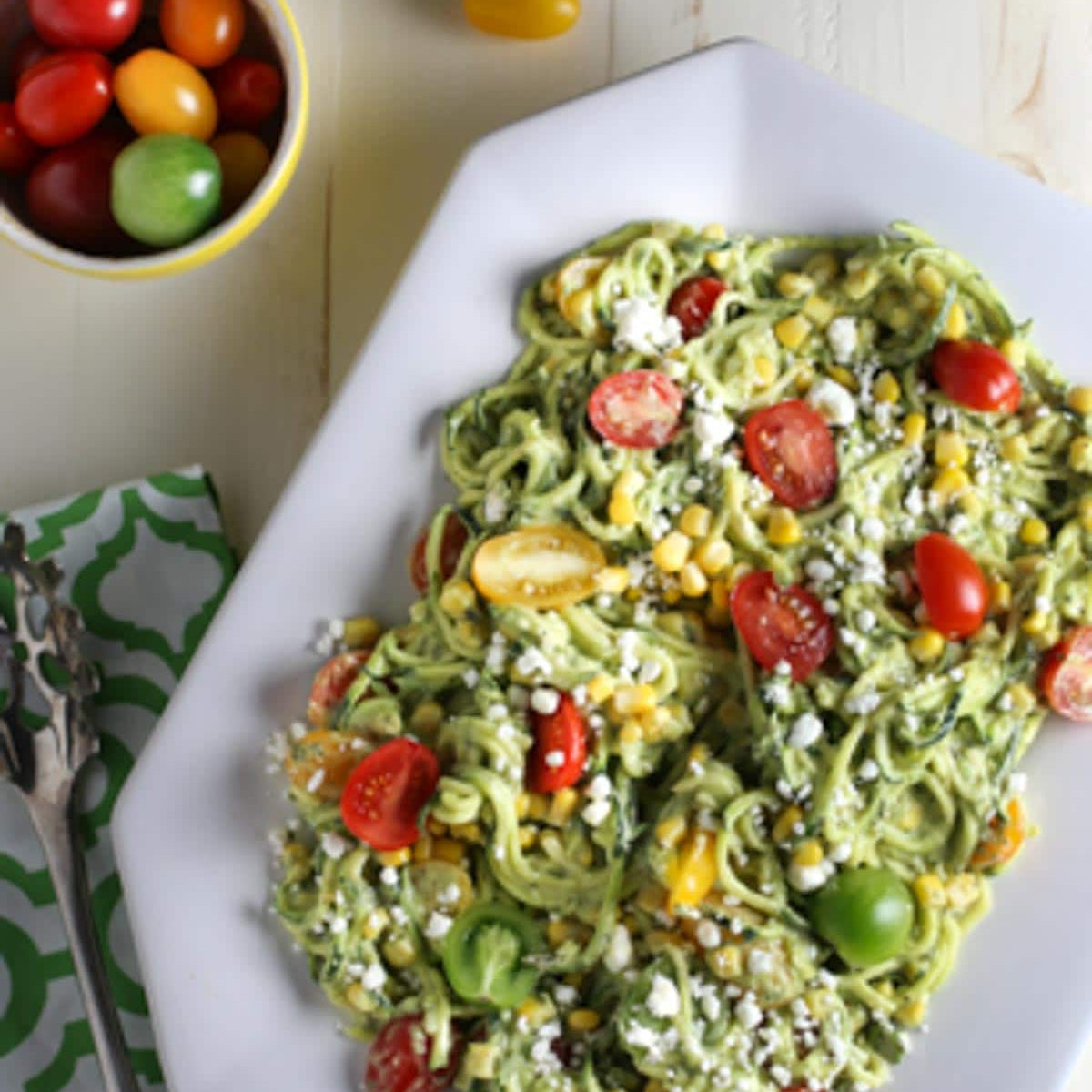 Zucchini Noodle Salad with Tomatoes, Goat Cheese, Corn and Avocado Sauce - World of Pastabilities