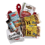 Front view of 14 oz bag of Cheerleading Pasta showcasing yellow label and tri-color cheerleader- and megaphone-shaped pasta on white background