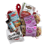 Front view of Kiss Me Pasta bag showcasing heart- and kiss-shaped multicolor pasta with pink label on white background