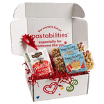 Front view of Happy Birthday Pasta 2-pack bag showcasing colorful birthday cake and present-shaped pasta on white background