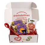 Front view of Black Cat Pasta 14 oz bag showcasing green and beige cat-shaped pasta and purple label on white background