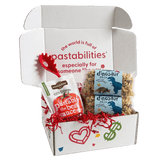 Front view of 14 oz Dinosaur Pasta bag showcasing dinosaur-shaped noodles through a clear window with blue label