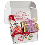 Front of two 14 oz Dance Dance Dance Pasta bags showing dancer-shaped tri-color pasta and pink label on white background