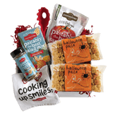 Angled view of two 14 oz Halloween Pasta bags showing pumpkin, ghost, and spider-shaped pasta on a white background
