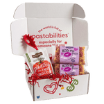 Front of 14 oz Kiss Me Pasta bag showing heart- and kiss-shaped pasta and pink label on white background
