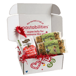Front view of Lacrosse Pasta 2-pack showing green and tan lacrosse-shaped noodles and product label on white background