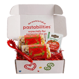 Front view of two 14 oz bags of Reindeer Pasta showcasing multicolored reindeer-shaped pasta and red label on white background