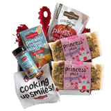 Front view of Princess Pasta 14 oz bag showcasing pink label and crown- and castle-shaped noodles on white background