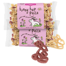 Front view of two Bunny Hop Pasta 14 oz bags with pink bunny hop pasta label and pink and yellow bunny-shaped pasta on white