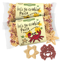 Front view of Let’s Go Crabin’ Crab Pasta 14 oz bag showcasing crab graphic and natural and red crab- and star-shaped pasta on white background