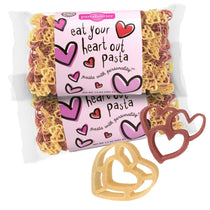 Front view of Eat Your Heart Out pasta showing two 14 oz packs with pink heart label and red and yellow heart-shaped pasta on white background